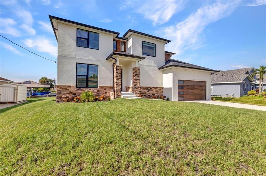 Front exterior of a new home in , Port Charlotte, FL, highlighting curb appeal (Image 17).