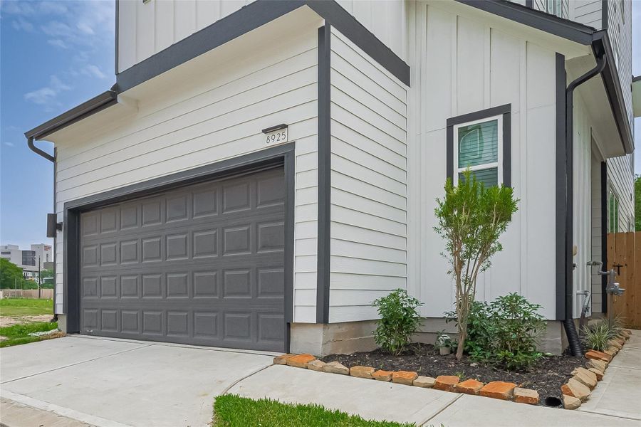 Front exterior of a new home in Regents Court, Houston, TX, highlighting curb appeal (Image 1).