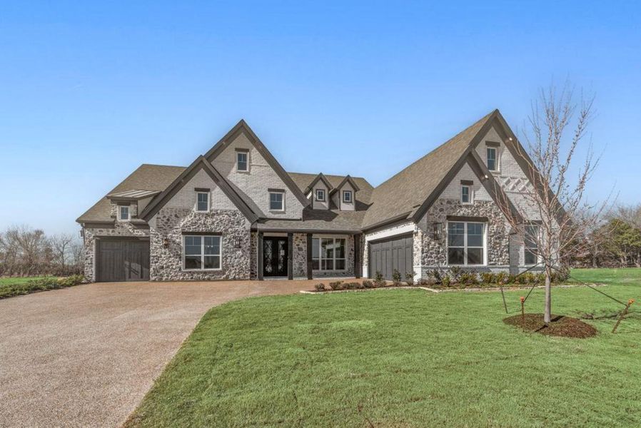 Representative exterior photo of a completed home built from the Grand Reserve by Grand Homes in Heath Golf & Yacht Club, Heath, TX (Image 16).