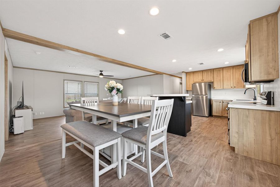 Alternate angle showing the dining space’s integration within the open-concept layout, enhancing flow and usability. Alternate angle showing the dining space’s integration within the open-concept layout, enhancing flow and usability.