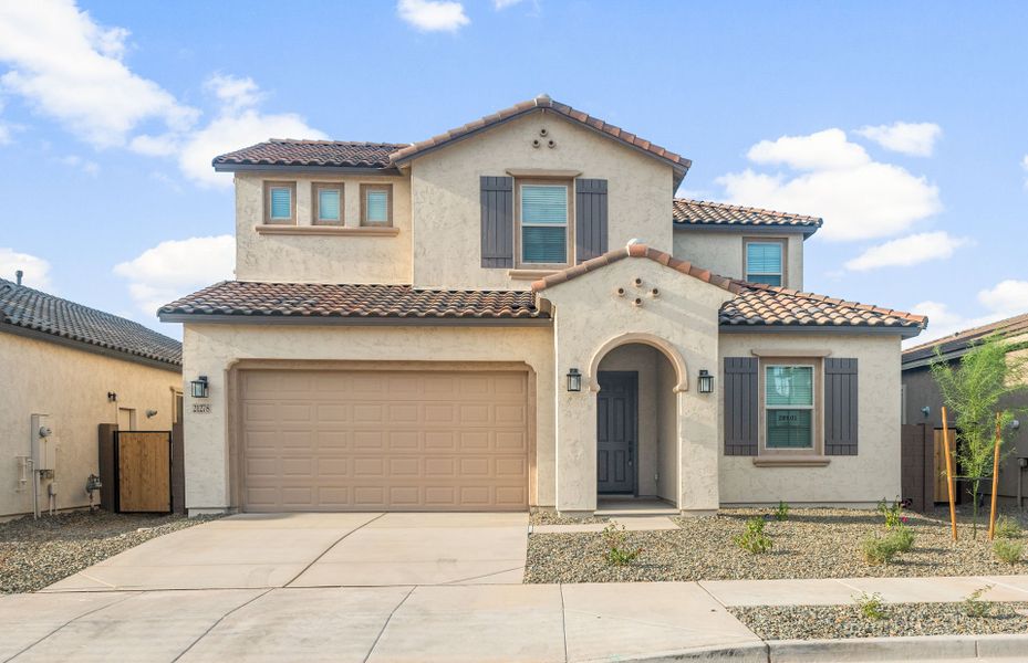 Front exterior of a new home in Jorde Farms, Queen Creek, AZ, highlighting curb appeal (Image 2). Front exterior of a new home in Jorde Farms, Queen Creek, AZ, highlighting curb appeal (Image 2).