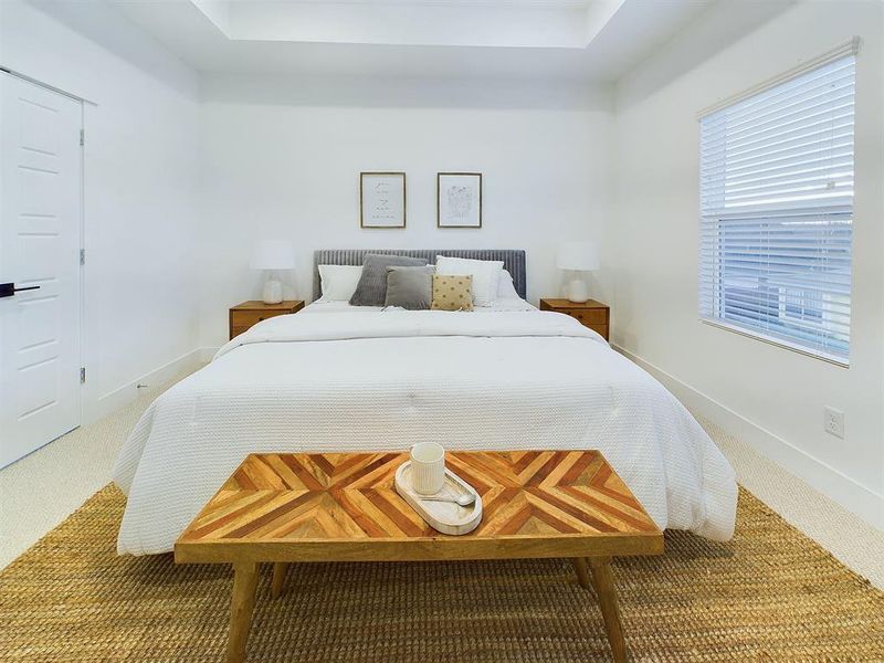 Gorgeous  primary bedroom on second floor with lots of natural lighting.