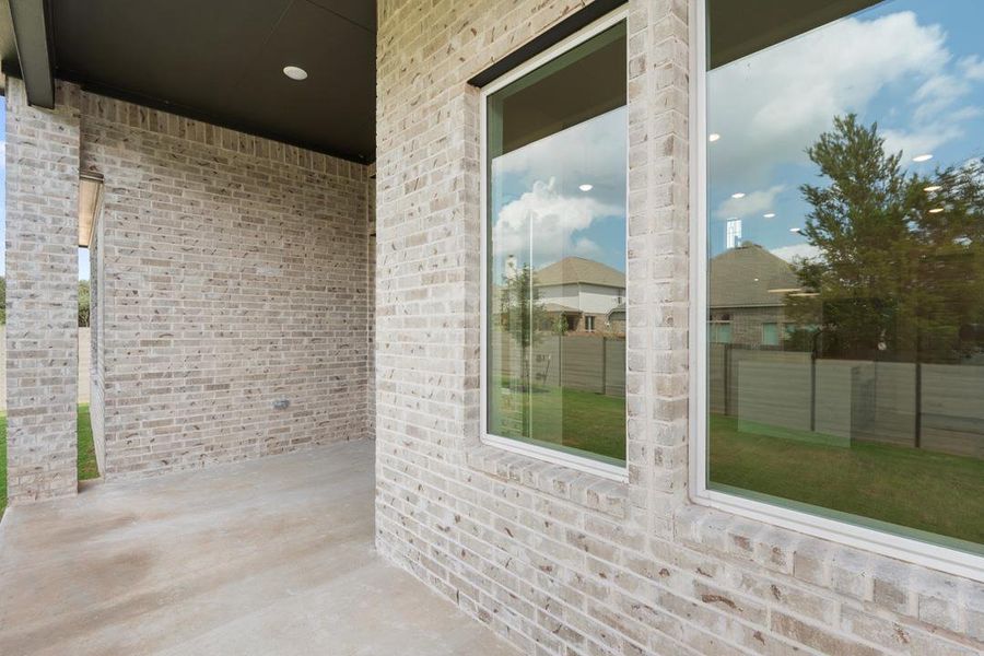 Exterior details and patio area of a home in Wolf Ranch, Georgetown (Image 19).