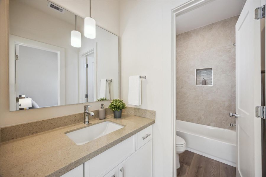 This secondary bathroom is fresh, modern, and thoughtfully designed with both style and functionality in mind.