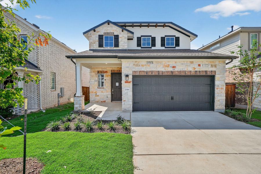 View of front of house featuring stone siding, driveway, a porch, an attached garage, and stucco siding View of front of house featuring stone siding, driveway, a porch, an attached garage, and stucco siding