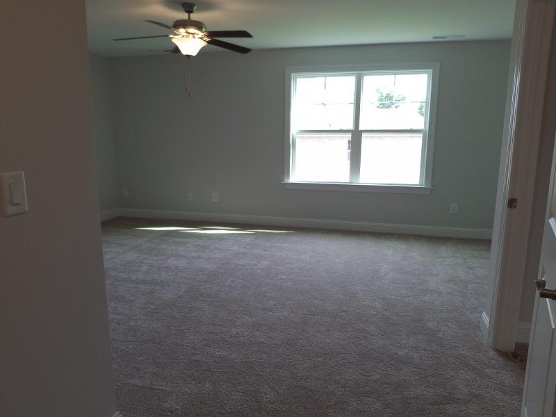Spacious, unfurnished interior of a new home in Weybridge, Burlington (Image 60).