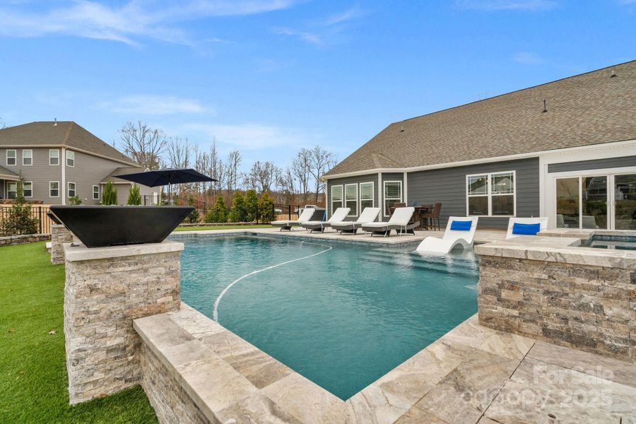 Spectacular in-ground pool & spa with Travertine decking & firebowls