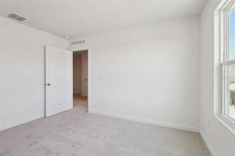 Spacious, unfurnished interior of a new home in Cyrene at Harmony, St. Cloud (Image 23).