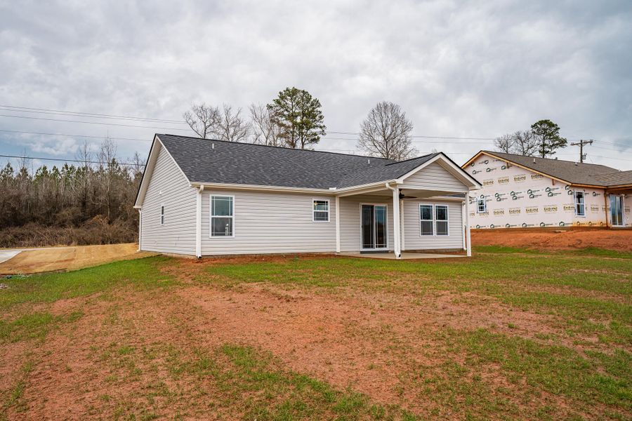 Representative exterior photo of a completed home built from the Saxon by Enchanted Homes in Huckleberry Cove, Chesnee, SC (Image 27). Representative exterior photo of a completed home built from the Saxon by Enchanted Homes in Huckleberry Cove, Chesnee, SC (Image 27).