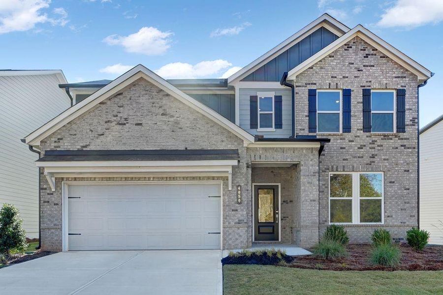Front exterior of a new home in Falls Creek, Flowery Branch, GA, highlighting curb appeal (Image 1).