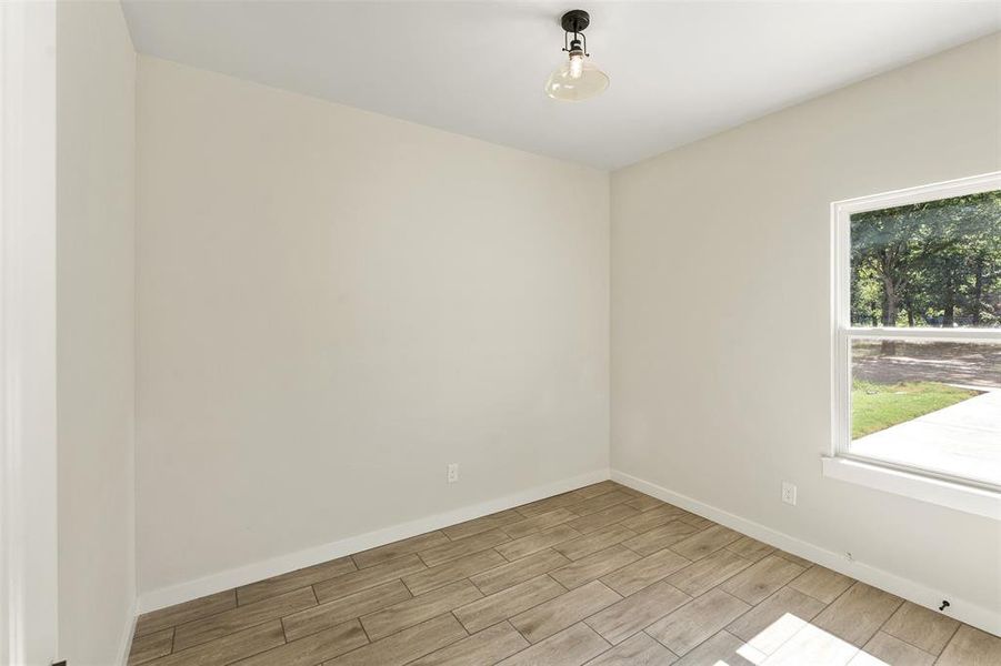 Neutral tone walls with wood-finish flooring Neutral tone walls with wood-finish flooring