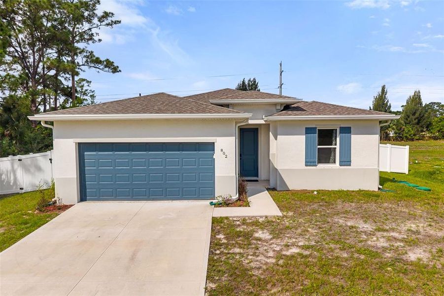 Front exterior of a new home in , Palm Bay, FL, highlighting curb appeal (Image 22).
