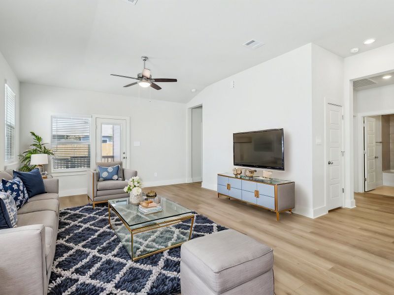 Virtually staged living room in the San Saba floorplan at a Meritage Homes community.