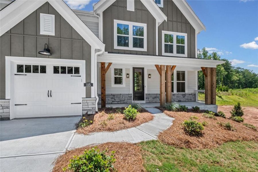 Front exterior of a new home in Woodberry, Canton, GA, highlighting curb appeal (Image 21). Front exterior of a new home in Woodberry, Canton, GA, highlighting curb appeal (Image 21).