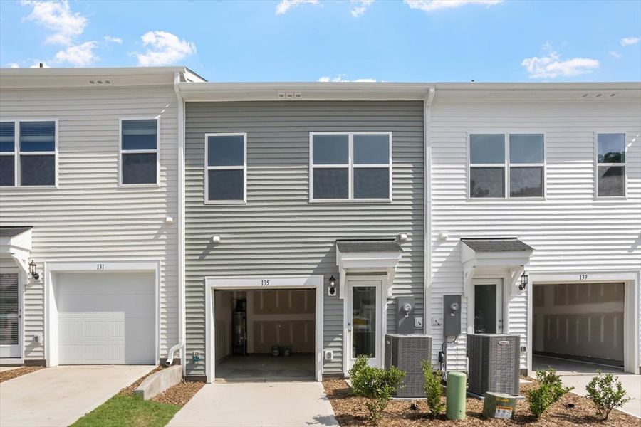 Front exterior of a new home in Renaissance at White Oak, Garner, NC, highlighting curb appeal (Image 2). Front exterior of a new home in Renaissance at White Oak, Garner, NC, highlighting curb appeal (Image 2).