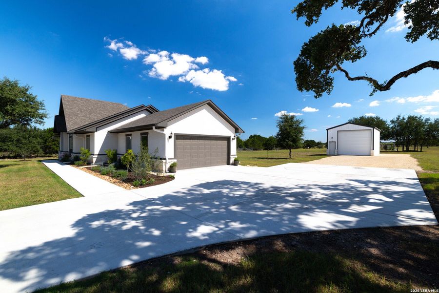 Front exterior of a new home in , Bandera, TX, highlighting curb appeal (Image 22).