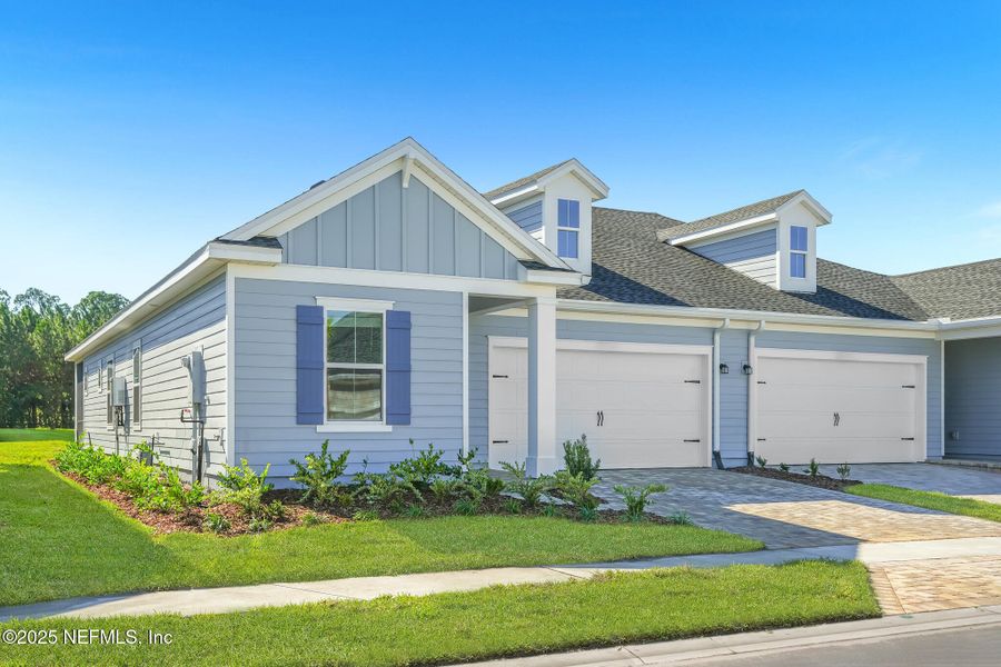 Front exterior of a new home in , St. Augustine, FL, highlighting curb appeal (Image 1).