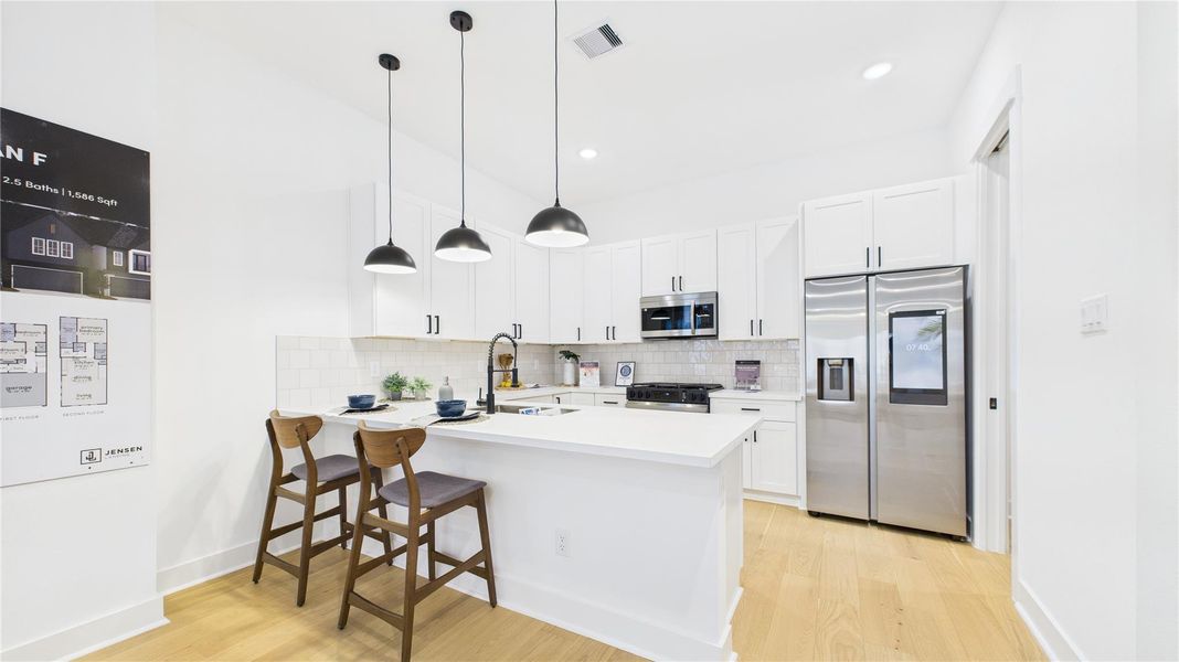 This beautifully designed open-concept kitchen is the perfect blend of style and functionality. Featuring a spacious kitchen peninsula, sleek stainless steel appliances, and ample countertop space, it offers a modern cooking and entertaining experience. The open layout seamlessly connects to the living and dining areas, creating a welcoming environment ideal for gatherings or everyday meals. Thoughtful design elements, quality finishes, and generous workspace make this kitchen a true standout in any home. This beautifully designed open-concept kitchen is the perfect blend of style and functionality. Featuring a spacious kitchen peninsula, sleek stainless steel appliances, and ample countertop space, it offers a modern cooking and entertaining experience. The open layout seamlessly connects to the living and dining areas, creating a welcoming environment ideal for gatherings or everyday meals. Thoughtful design elements, quality finishes, and generous workspace make this kitchen a true standout in any home.