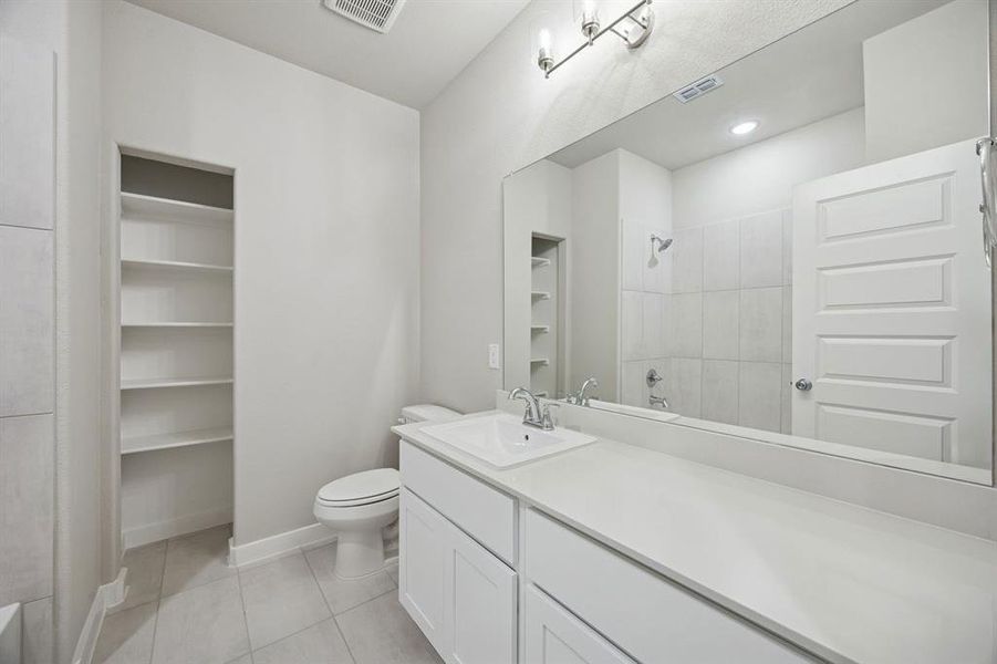 Bathroom in the Stanley II home plan by Trophy Signature Homes – REPRESENTATIVE PHOTO