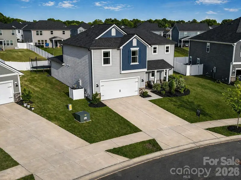 Front exterior of a new home in Wilson Creek Executive Series, Indian Land, SC, highlighting curb appeal (Image 21).