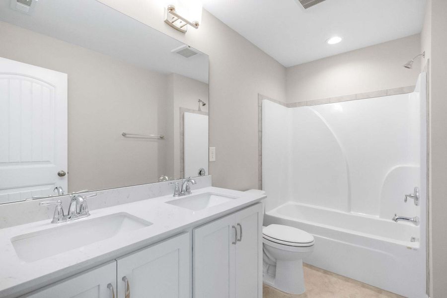 Representative furnished interior of a home built from the Aberdeen by Caviness & Cates Communities in Bartlett Manor, Youngsville (Image 200).