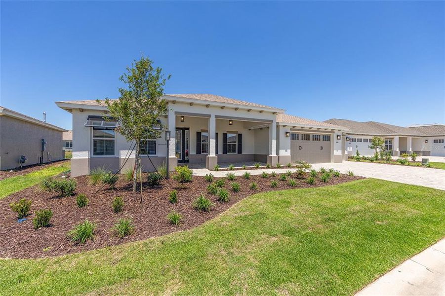 Front exterior of a new home in , Ocala, FL, highlighting curb appeal (Image 1). Front exterior of a new home in , Ocala, FL, highlighting curb appeal (Image 1).
