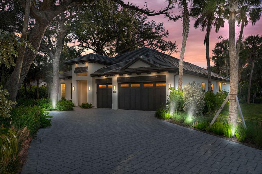 Front exterior of a new home in Seaglass, Vero Beach, FL, highlighting curb appeal (Image 1).