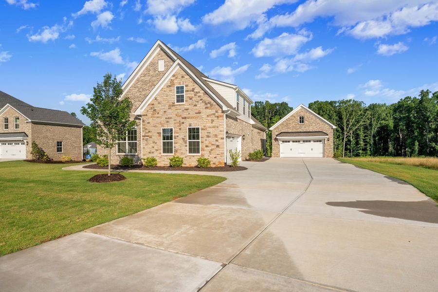 Front exterior of a new home in Walnut Grove, Easley, SC, highlighting curb appeal (Image 22).