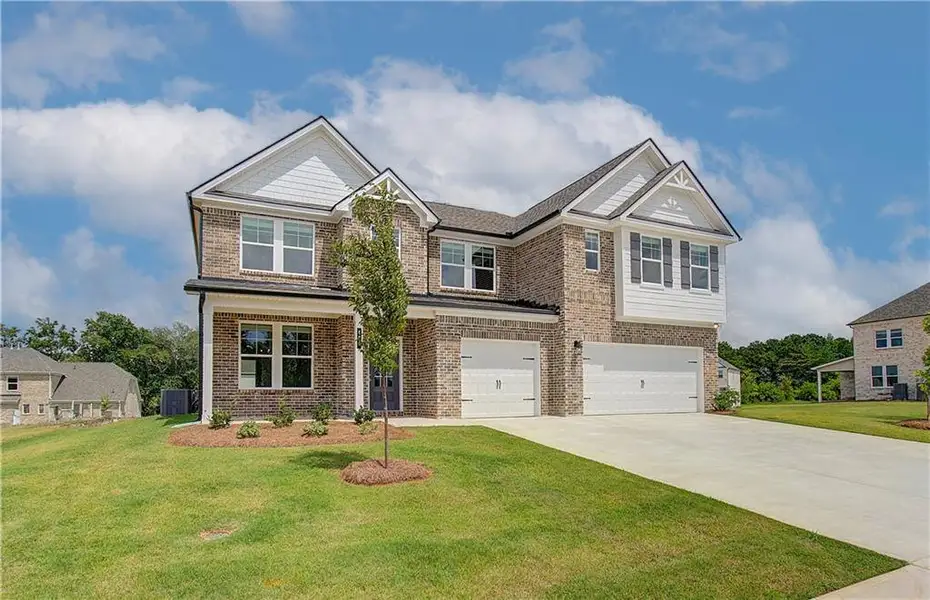 Front exterior of a new home in Westwind Estates, Hampton, GA, highlighting curb appeal (Image 20).