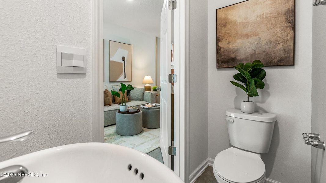 Furnished interior in a model home at Cordera Townhomes in St. Augustine (Image 7).