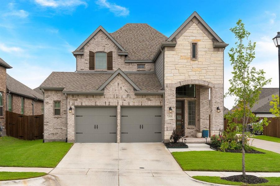 Front exterior of a new home in Avondale, Fate, TX, highlighting curb appeal (Image 2). Front exterior of a new home in Avondale, Fate, TX, highlighting curb appeal (Image 2).