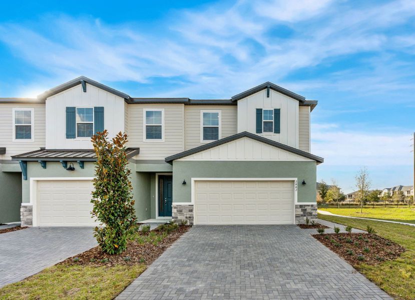 Front exterior of a new home in Magnolia Reserve, Ocoee, FL, highlighting curb appeal (Image 24).