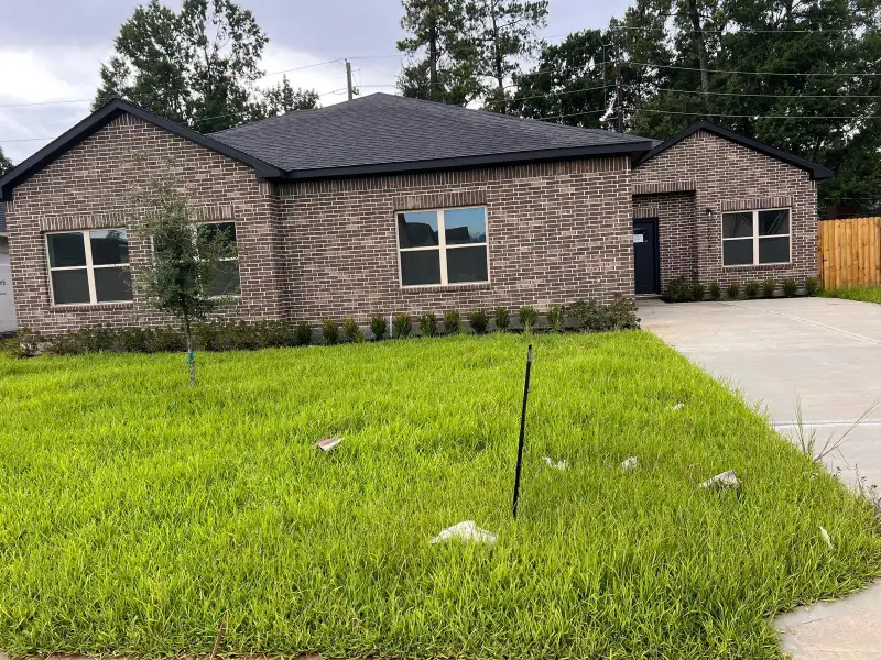Front exterior of a new home in , Spring, TX, highlighting curb appeal (Image 2).