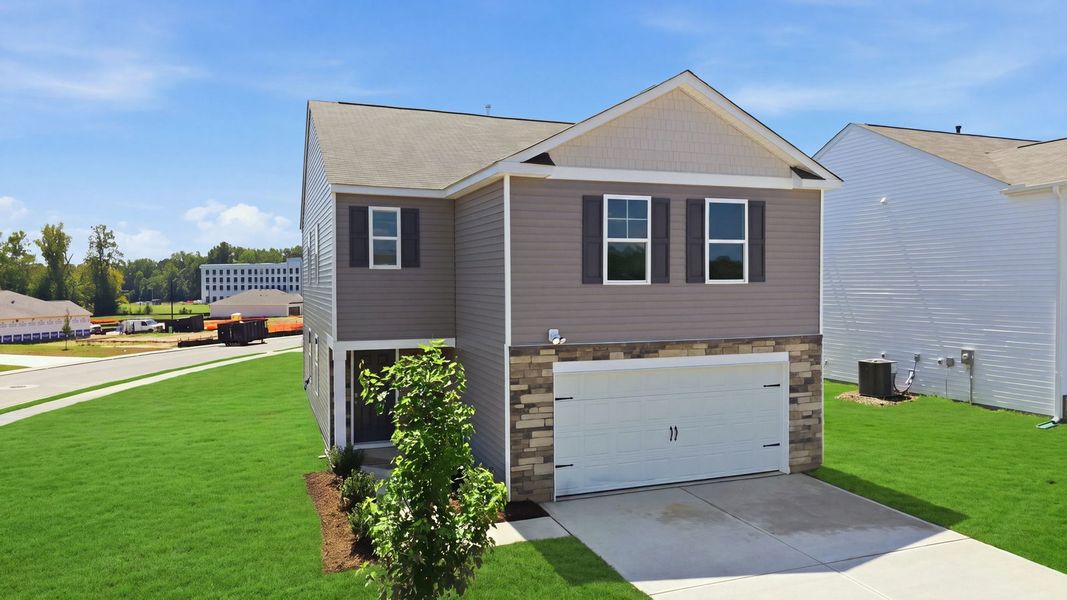 Front exterior of a new home in Hunter Hill, Rocky Mount, NC, highlighting curb appeal (Image 2). Front exterior of a new home in Hunter Hill, Rocky Mount, NC, highlighting curb appeal (Image 2).
