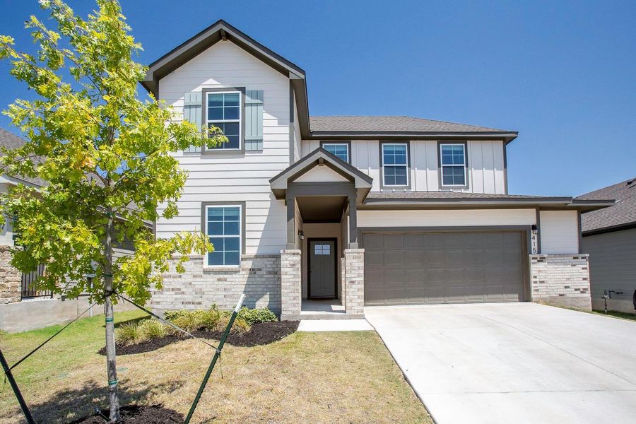 Front exterior of a new home in Brooks Ranch, Kyle, TX, highlighting curb appeal (Image 25).