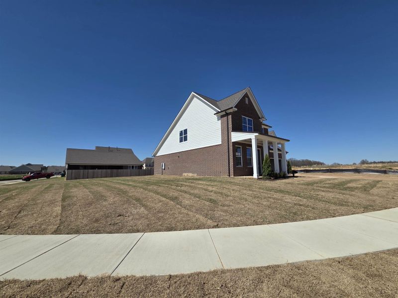 Front exterior of a new home in Twin Oaks, Oakland, TN, highlighting curb appeal (Image 17).