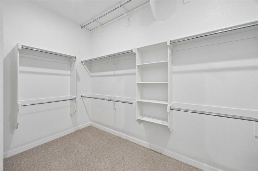 Primary Walk-In Closet in the Picasso II home plan by Trophy Signature Homes – REPRESENTATIVE PHO Primary Walk-In Closet in the Picasso II home plan by Trophy Signature Homes – REPRESENTATIVE PHO