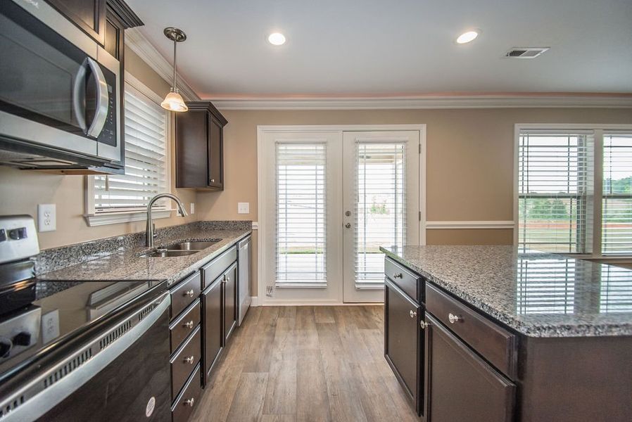 Representative furnished interior of a home built from the Reynolds by Enchanted Homes in Hampshire Heights, Moore (Image 15).