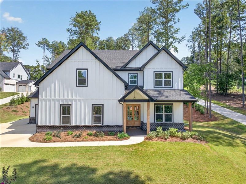 Front exterior of a new home in , Winder, GA, highlighting curb appeal (Image 2).