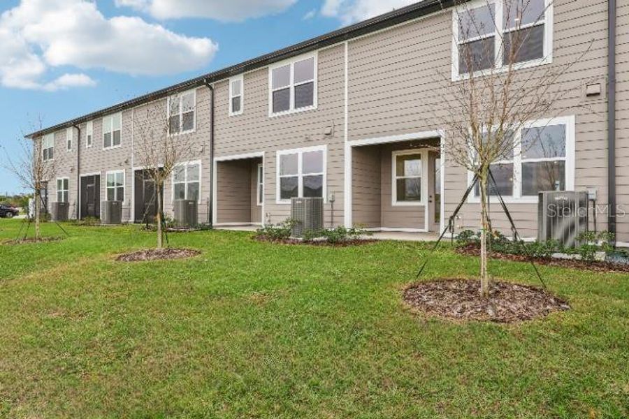 Exterior details and patio area of a home in Catamaran Cove Townhomes, Rockledge (Image 20).