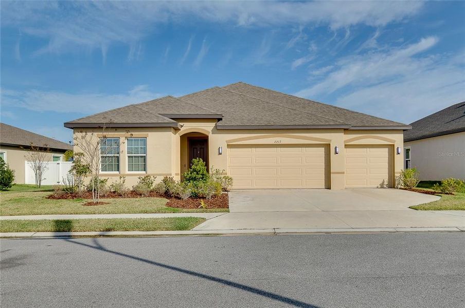 Front exterior of a new home in , Bradenton, FL, highlighting curb appeal (Image 2).