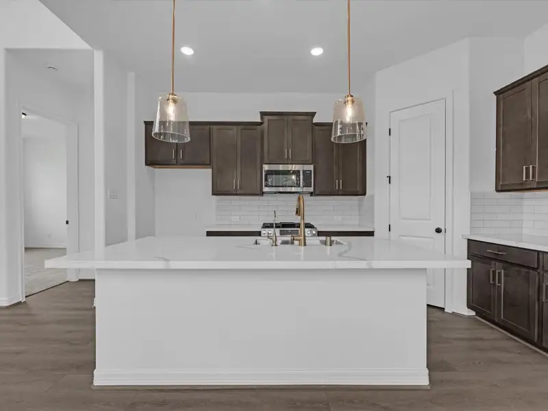 Kitchen. Sample product photo. Actual exterior and interior selections may vary by homesite. Photo may be virtually staged. Kitchen. Sample product photo. Actual exterior and interior selections may vary by homesite. Photo may be virtually staged.