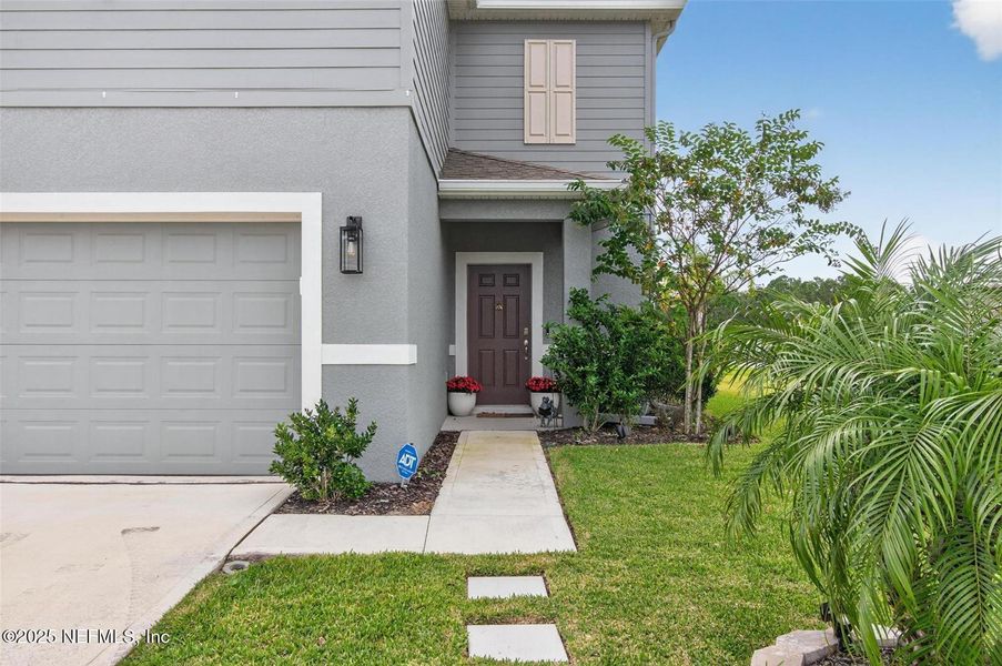 Exterior details and patio area of a home in Sawmill Creek at Palm Coast Park, Palm Coast (Image 28).