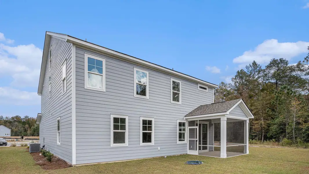 Exterior details and patio area of a home in Brunswick Plantation, Ash (Image 3).