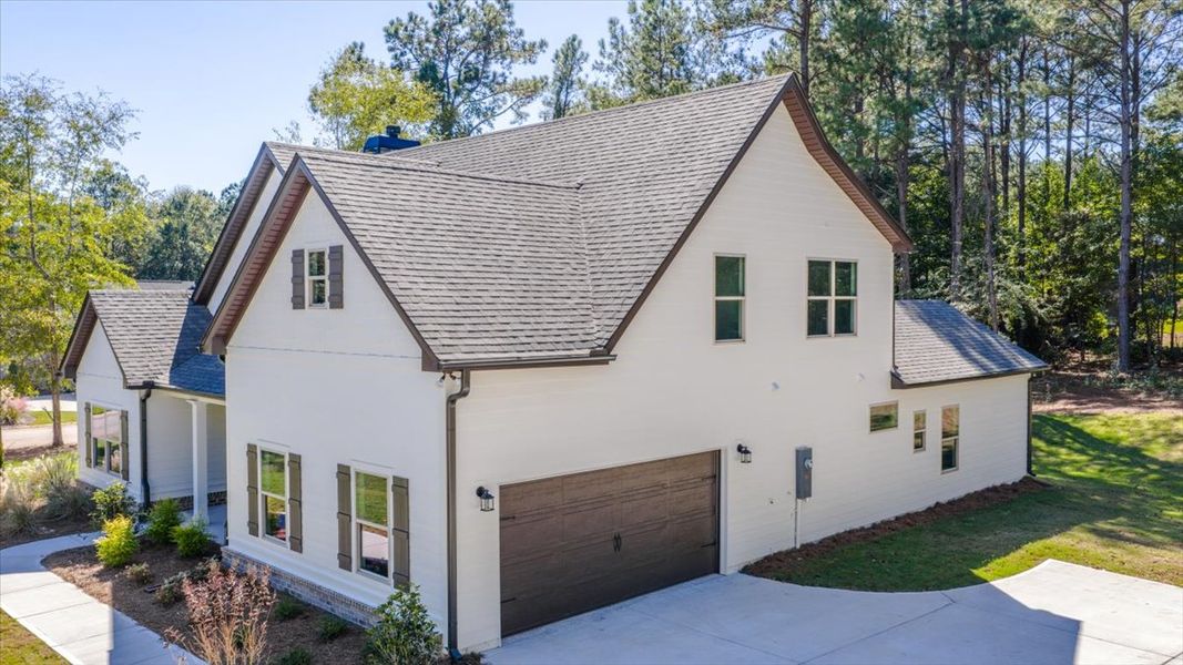 Front exterior of a new home in Fair Oaks, Thomaston, GA, highlighting curb appeal (Image 1). Front exterior of a new home in Fair Oaks, Thomaston, GA, highlighting curb appeal (Image 1).