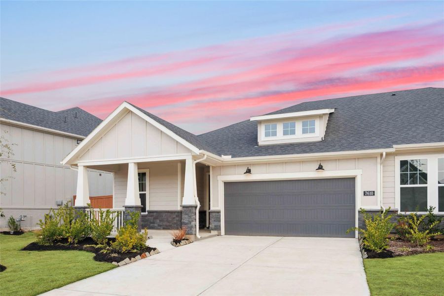 Front exterior of a new home in Elyson, Katy, TX, highlighting curb appeal (Image 2).
