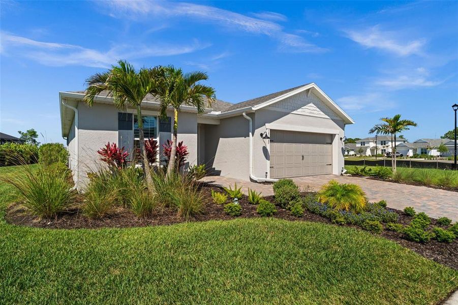 Front exterior of a new home in , Punta Gorda, FL, highlighting curb appeal (Image 20).