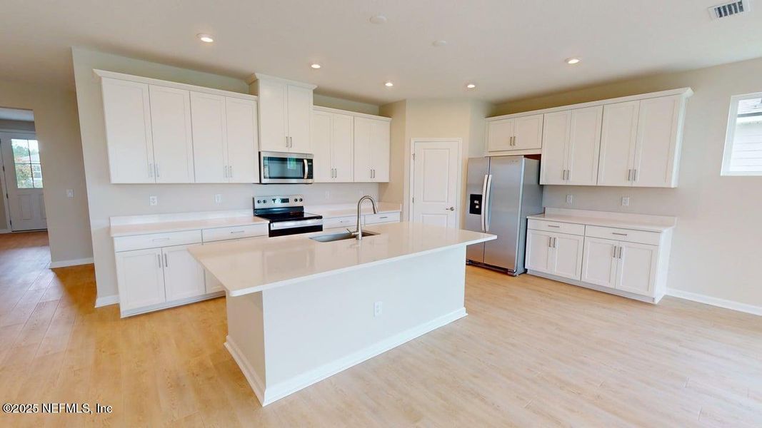 Furnished interior view inside a new home in Lakes at Bella Lago, Green Cove Springs (Image 7).