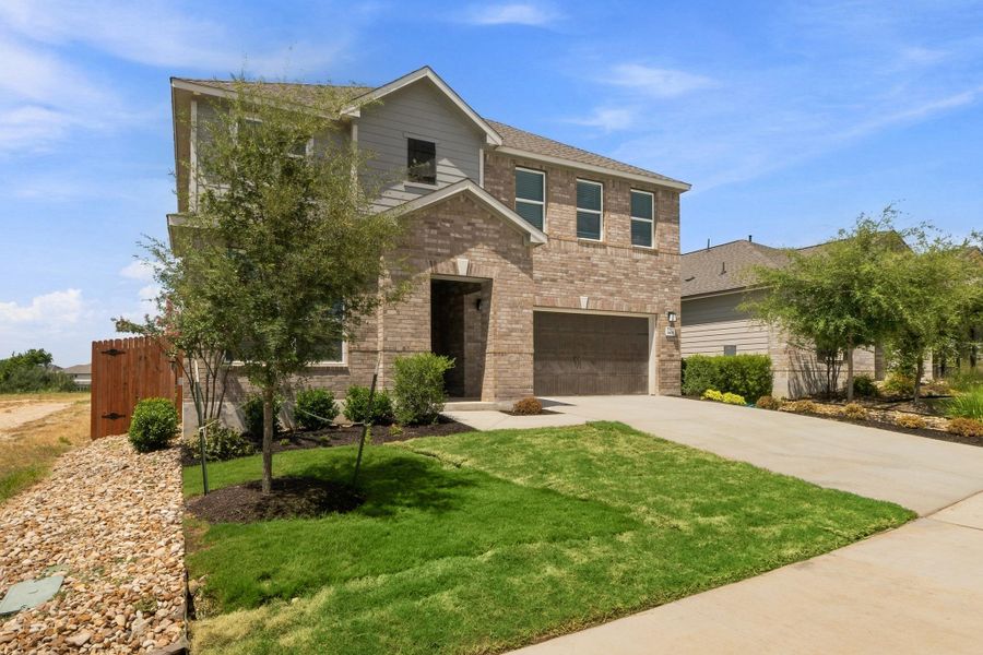 Front exterior of a new home in River Bluff, Leander, TX, highlighting curb appeal (Image 2). Front exterior of a new home in River Bluff, Leander, TX, highlighting curb appeal (Image 2).