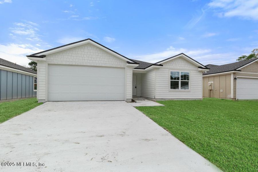 Front exterior of a new home in , Jacksonville, FL, highlighting curb appeal (Image 2). Front exterior of a new home in , Jacksonville, FL, highlighting curb appeal (Image 2).